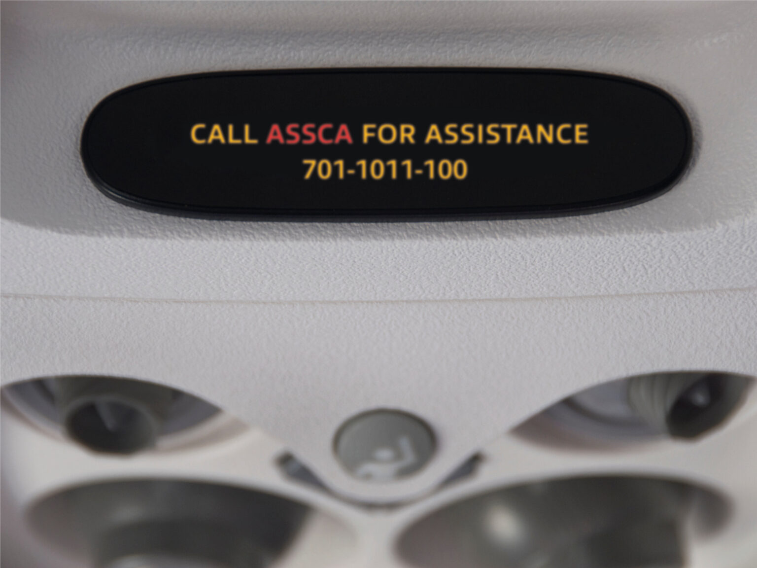 black plane sign with ASSCA message