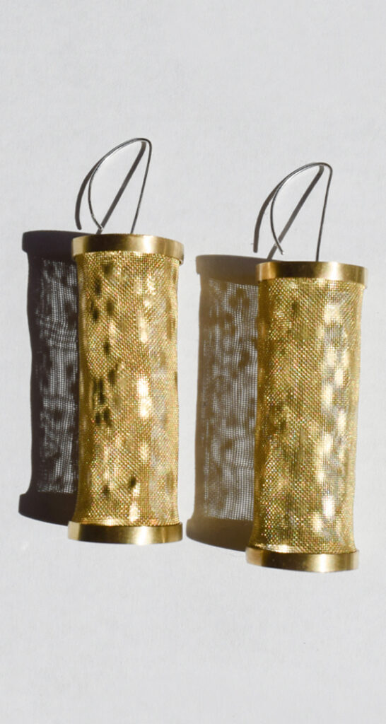 brass earrings, made from wire and woven wire mesh with light reflecting from the surface.
